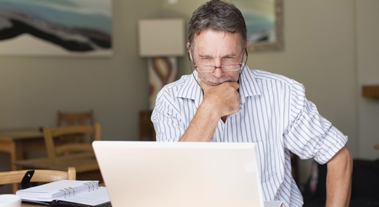 Man Looking at laptop